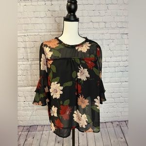 Black top with floral decor